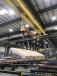 The Posi-Turner is operated beneath the hook of a 15-ton capacity overhead crane. 