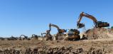 There are 21 Bell off-road dump trucks on the site, along with seven Hyundai 480 excavators and 10 dozers. 