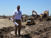 Brittain Griffith, owner of Sonora Construction in Houston, checks on progress at the Bridgeland subdivision site. Story on page 40.  Sonora is moving 2.4 million cu. ft. of dirt to create a 4-mi.-long string of lakes in the Howard Hughes Company development. 