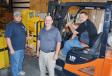 Moving products in and putting the final touches on the parts area (L-R) are Brandon Schodors, parts sales; Trent Davis, product support manager; and Grant Costa, assistant parts manager.
