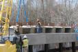 Crews from Southeastern Site Development place a beam on the Johnson County Bridge. 