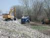 The USACE’s Armourdale Unit works on laying rip rap on another portion of the Kansas Citys Levee project.
(USACE photo)