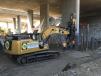A Cat 349F excavator, provided by OTAY Equipment and Sales is helping to drive piles beneath a flyover bridge under construction. 