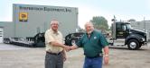 SEI Trailer Sales Manager John Conner (L) shakes hands with H&K Group Fleet Superintendent Dan Alderfer on yet another Rogers Brothers trailer deal. 