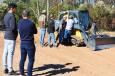 After a few passes, a group of attendees at the metro Atlanta demo talk about the machine productivity and overall operation with the grading system.  
 