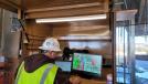 Senior Project Superintendent Shane Henry using his “BIM Box” out in the field, equipped with Wi-Fi and centrally located on the third floor of what will be the new Oroville Hospital tower. 