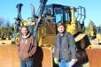 Getting ready to calculate their best offer on this Cat D6 are Jason Patterson (L) and Jay Brooks of Heavy Yellow Equipment in Atlanta, Ga.