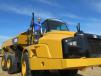 Ryan Brouillette, used equipment sales, Foley Equipment, Wichita, Kan., looks over this Caterpillar 740B artic truck.