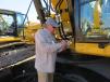 Checking the serial number of this Caterpillar 336 excavator is Joe Leduc, Bayou City Equipment, Houston, Texas.