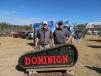 John Lide (L), sales manager, and Ken Byrd, president, Dominion Rubber Tracks, Ashland, Va., display their equipment at the annual auction.