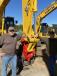 From Volusia County, Fla., and checking out the strong lineup of Komatsu excavator are  George White (L) and Gene Palmatier. 