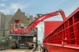 The red 840 R-HD on a 5 ft. (1.5 m) pylon from Sennebogen now supports ATR Landhandel GmbH & Co.KG in bulk material handling. 