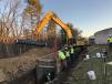 Heavy machinery on site includes a Komatsu excavator PC 650 LC 8; a Komatsu WA 470; Cat excavator 325 zero turn; American Auger 48/54-900 Quick/Split; Cat D5K LGP; and a Cat 950M loader for pipe installation. 
(Waukesha Water Utility)
 