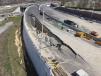 An aerial photo shows the top of a partially collapsed retaining wall on I-295 in Bellmawr. The bottom of the wall is bowed outward where the roadway surface on top fell in March 25.  (NJ.com photo) 