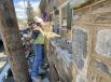 Carefully matching 18th-and 19th-century mortar styles used on adjacent structures, skilled masons build one of the signature stone walls in the center of Hillsboro.