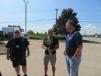 Ken Schmidt (R) of McCann Industries talks sweepers with Mike Dunaj (L) and Ignacio Garcia. 
