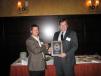 Rolf Helland (R) of Illinois Truck & Equipment accepts the President’s Award from Mark Harbaugh of Ditch Witch Midwest. 
