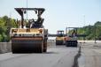 Asphalt paving operations in the medians of the I-485 Express Lanes project in southern Mecklenburg County. The newly paved surfaces will become variable-toll express lanes and general purpose lanes along the 18-mi.-long project zone.