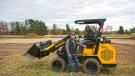 Rich Droste (L) of Hummerbee and Bob Best, owner of Best Excavation, with the Hummerbee 721R  4-wheel drive compact articulated loader.  