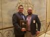 The Presidential Plaque was presented to Jason Zeibert (L) of Finkbiner Equipment Company by Adam Salinas of Illinois Truck & Equipment. 