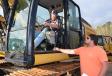 Discussing a Cat 336E excavator of interest are Chris Grogan (in cab) and Jackson Deal of 3D Excavating, Fayette, Ala. 