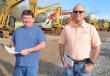 Walking the equipment yard looking for their next machine are Mark Juckes (L) and Shaun Ivey of Sorbent Supply Inc., West Point, Miss. 
