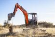 The DX35Z-7 mini excavator features a zero tail swing design with a rounded shape.