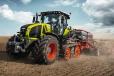 The updated AXION 900 TERRA TRAC (TT) tractor adds a half-track design with marked advantages in comfort, efficiency and traction in many farming applications. 