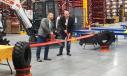 Brad Claus (L), VP Aftermarket Parts & Service, Bobcat Company and Fabio Duque, regional vice president Americas, perform the ceremonial ribbon cutting.