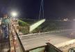 A crane lifts and removes an iron beam from the bridge.
(Photo courtesy of Maine DOT) 