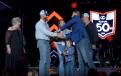 U.S. Army veteran Brian Gorman receives the keys to his new M7 Series tractor from Kubota’s Alex Woods during a special ceremony at Kubota’s annual dealer meeting in Grapevine, Texas. 