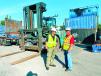 Linder sales representative Carlos E. Gomez (L) helps Bill Peters, director of maintenance of SEACOR Island Lines, find the right machines for the shipping company’s operations. (Photo courtesy of Linder Link Magazine)