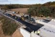 Paving is in full swing to prepare to open the highway back up to traffic. New barrier has been installed.
(Photo courtesy of H&K Group Inc.) 