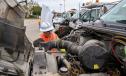 Joey Gunnels of the Austin District inspects a vehicle.
(Photo courtesy of TxDOT.)