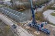 ALL used one of its own Liebherr LTM 1650-8.1 all-terrain cranes to assist general contractor Kenmore Construction in setting a 340-ton, 200-ft. Acrow temporary bridge. 