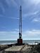 The cranes will help lower 54-in. diameter CPVC pipe into the ocean, where underwater divers will make the necessary connections to construct the 1,500-ft. pipeline extending from the beach. 