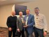 Tim Watters (third from L), president and CEO of Hoffman Equipment, accepts the 2022 Dealer of the Year award from (L-R) Volvo Group President Martin Lundstedt, President of Volvo CE Region North America Stephen Roy and Volvo CE President Melker Jernberg. 