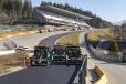 The legendary Raidillon uphill sweeping Formula 1 corner, with its 20 percent gradient, is one of the great challenges for the paving operation. The new spectator stand is at the top of the hill. 