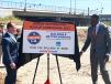 Caltrans Director Tony Tavares (L) and California Transportation Secretary Toks Omishakin unveil a project sign with the new Rebuilding California logo on it.
(Caltrans photo) 