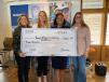 Skanska presents a check to further support YWLA’s commitment to STEM education. (L-R): Lynn Hammer, executive director, Foundation for the Young Women’s Leadership Academy of Fort Worth; Meloni Raney, TEXCO president, CEO and YWLA board member; Tamara Albury, principal of YWLA; and Kimberly Burke, Skanska vice president of business development. 
(Skanska photo) 