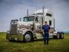 Driver Chris Koenig in front of the Kenworth 75th anniversary Limited Edition Kenworth W900L. 
