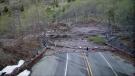 Shortly after 9 p.m. Sunday, May 14, more than 300,000 cu. yds. of debris from an adjacent hillside fell approximately 2,000 ft. above SR 504 and covered the roadway with rock, mud, ice and water.
(WSDOT photo) 