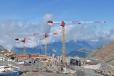 The complex, high-altitude project features a mix of Potain self-erecting and top-slewing tower cranes. 