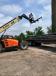 A JLG RT lift is used to unload and stockpile repair plates.
(Aetna Bridge photo) 