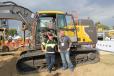 Lars Arnold (L), Volvo Construction Equipment, Shippensburg, Pa., talks with James Miller of Amtrak in Wilmington, Del., about Volvo’s EC230 electric excavator with Dig Assist.
(CEG photo) 