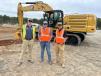 (L-R): Nathan Skipper of Carolina Cat goes over the advanced Cat 340 excavator with Colby and Drew Turner, both of Turner Site Services in Charlotte, N.C.(CEG photo)
