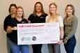 The 2023 Trailer for a Cause check presentation to Pockets of Hope Team:  (L-R) are Jennifer Bruzek, Briana Sjodin and Lisa Schroers, all of Pockets of Hope, and Brenda Jennissen and Bonnie Radjenovich, Felling Trailers’ owners. 