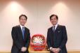 Hiroyuki Ogawa (L), president and CEO of Komatsu Ltd., and Subhash Dhar, chairman and CEO of ABS.