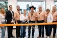 Premier Truck Rental’s (PTR) leadership team cuts a ribbon alongside a Fort Worth Chamber of Commerce representative, celebrating the opening of their DFW facility. 
(Premier Truck Rental photo) 