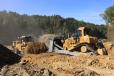 A Cat D9 dozer trap dozing to a Cat 992 loader to help improve bucket fill factor.
(Boyd CAT photo) 